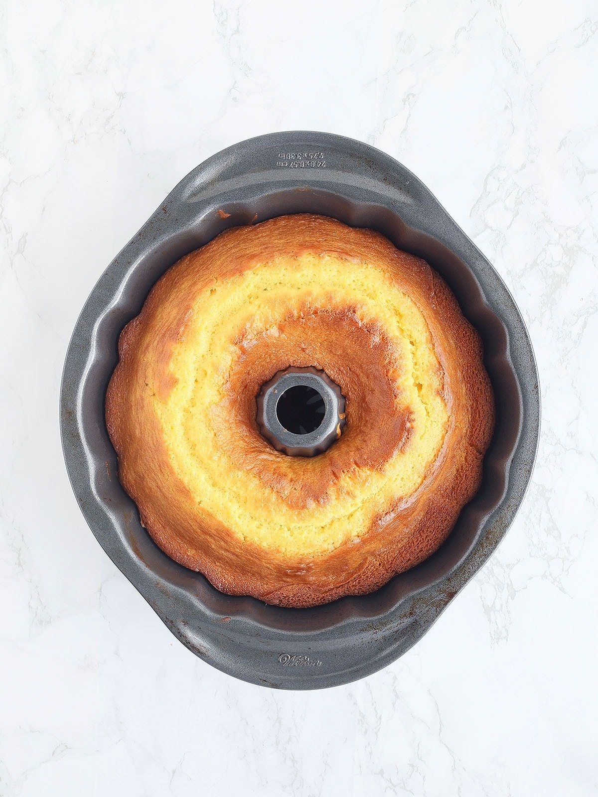 Baked apricot nectar cake cooling in the Bundt pan