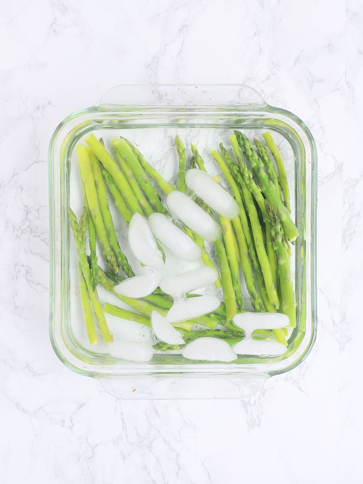 asparagus in a bowl of ice water