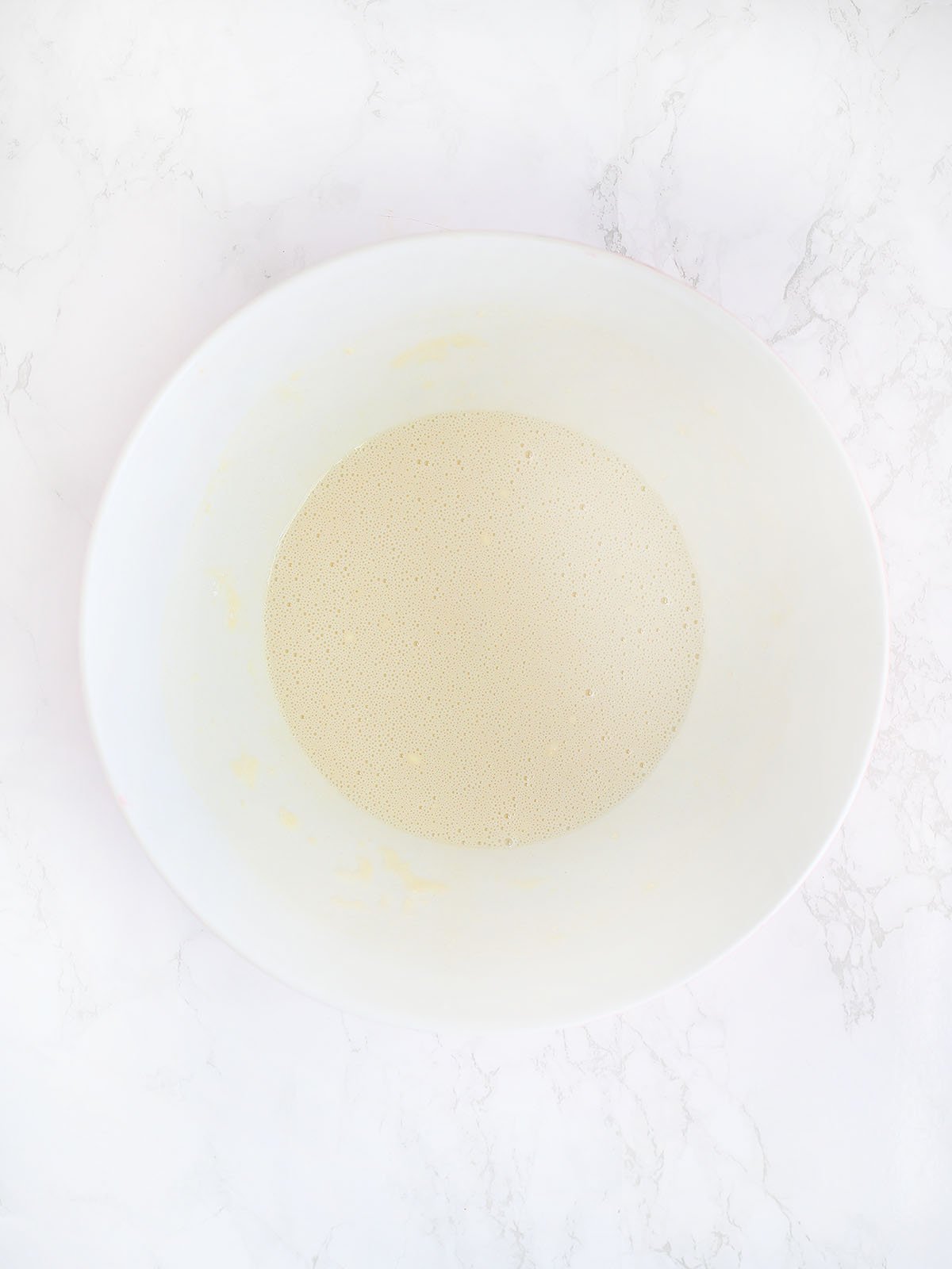 cobbler crust batter in a white mixing bowl