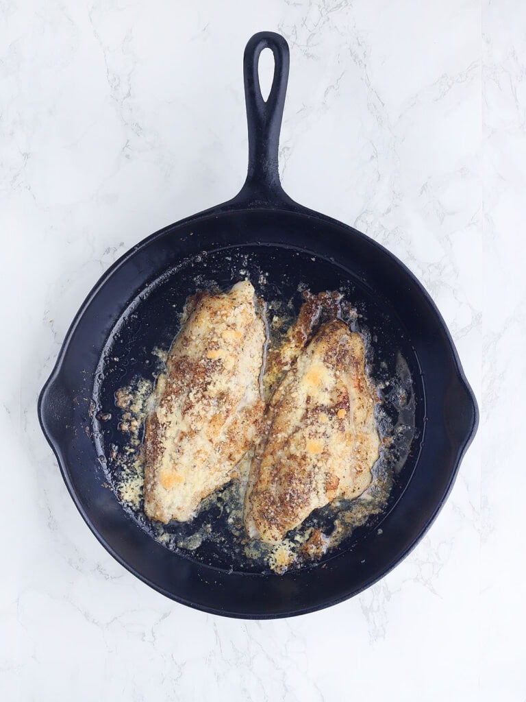 Pan seared catfish fillets after they have been under the broiler