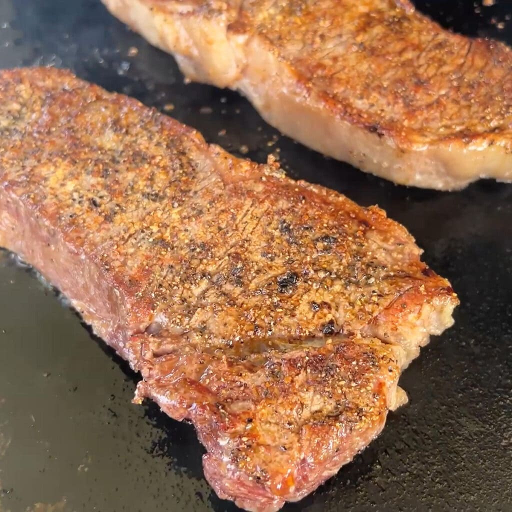 What the surface of the steak should look like after it has been seared.