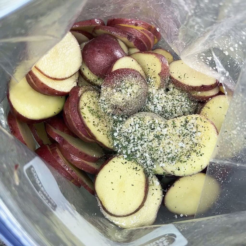 All-purpose seasoning added to the plastic bag with the sliced potatoes and olive oil.