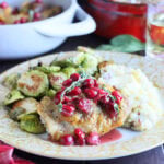 Single serving of cranberry chicken with mashed potatoes and roasted Brussels sprouts.