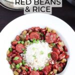 Dish of Instant Pot red beans and rice with an Instant Pot electric pressure cooker and a serving bowl of cooked rice in the background.