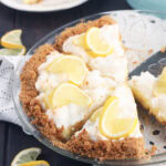 Sliced lemon icebox pie garnished with fresh lemon slices.