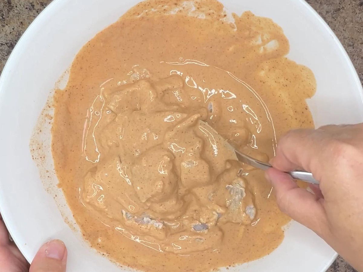 Coating catfished pieces in the been batter.