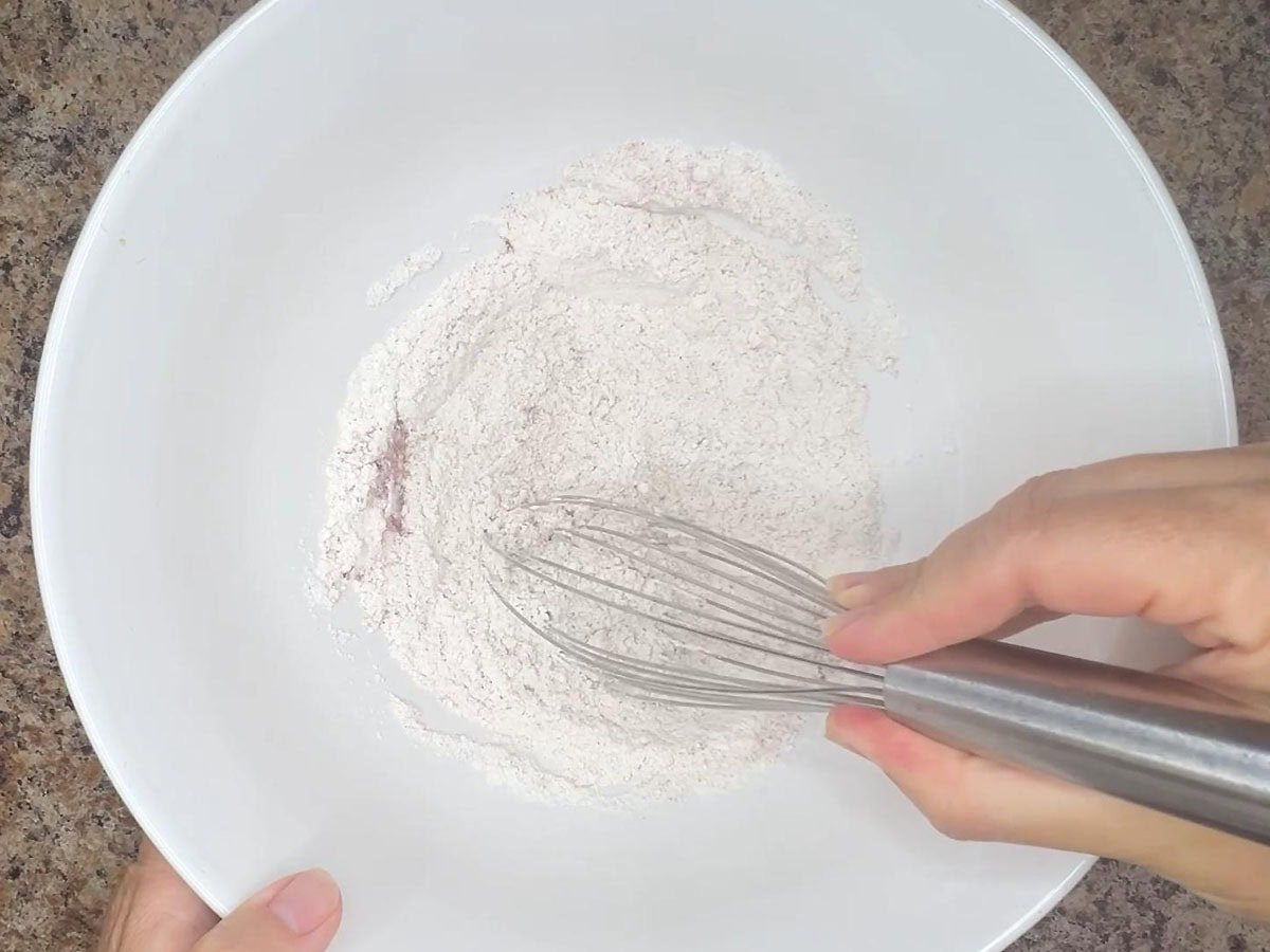 Whisking together the flour and seasonings.