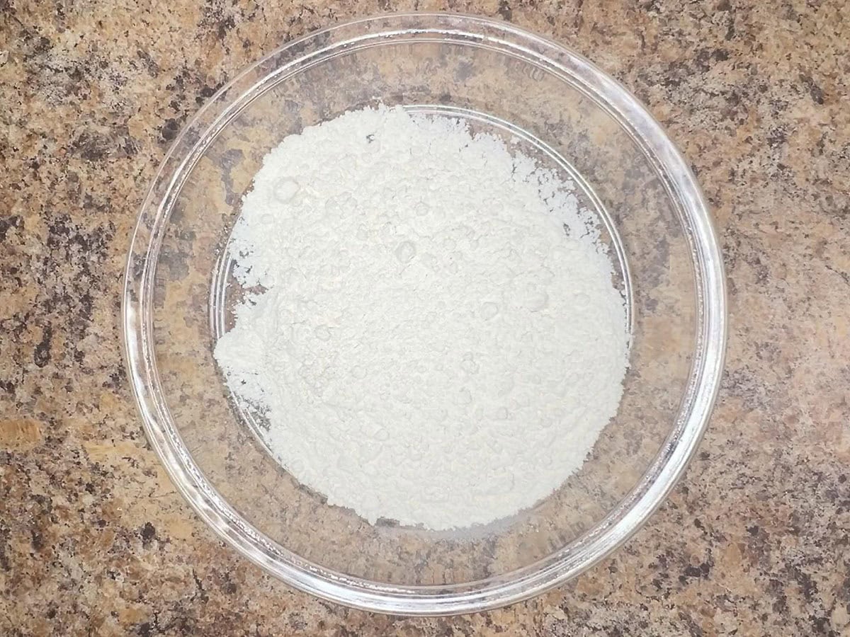 Flour in a shallow dish.