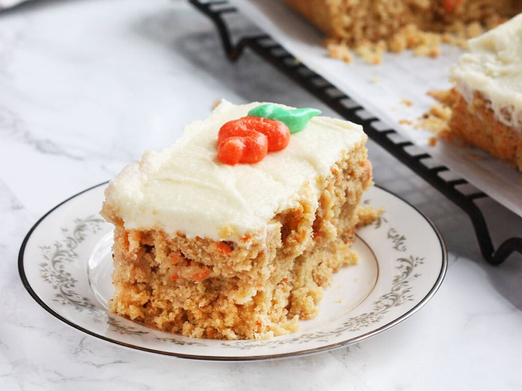 Once slice of pineapple carrot cake on a plate.