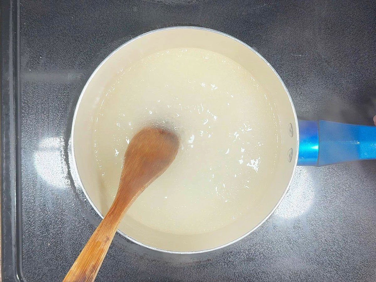 Sugar, lemon-lime soda and cornstarch mixture starting to thicken as it boils.