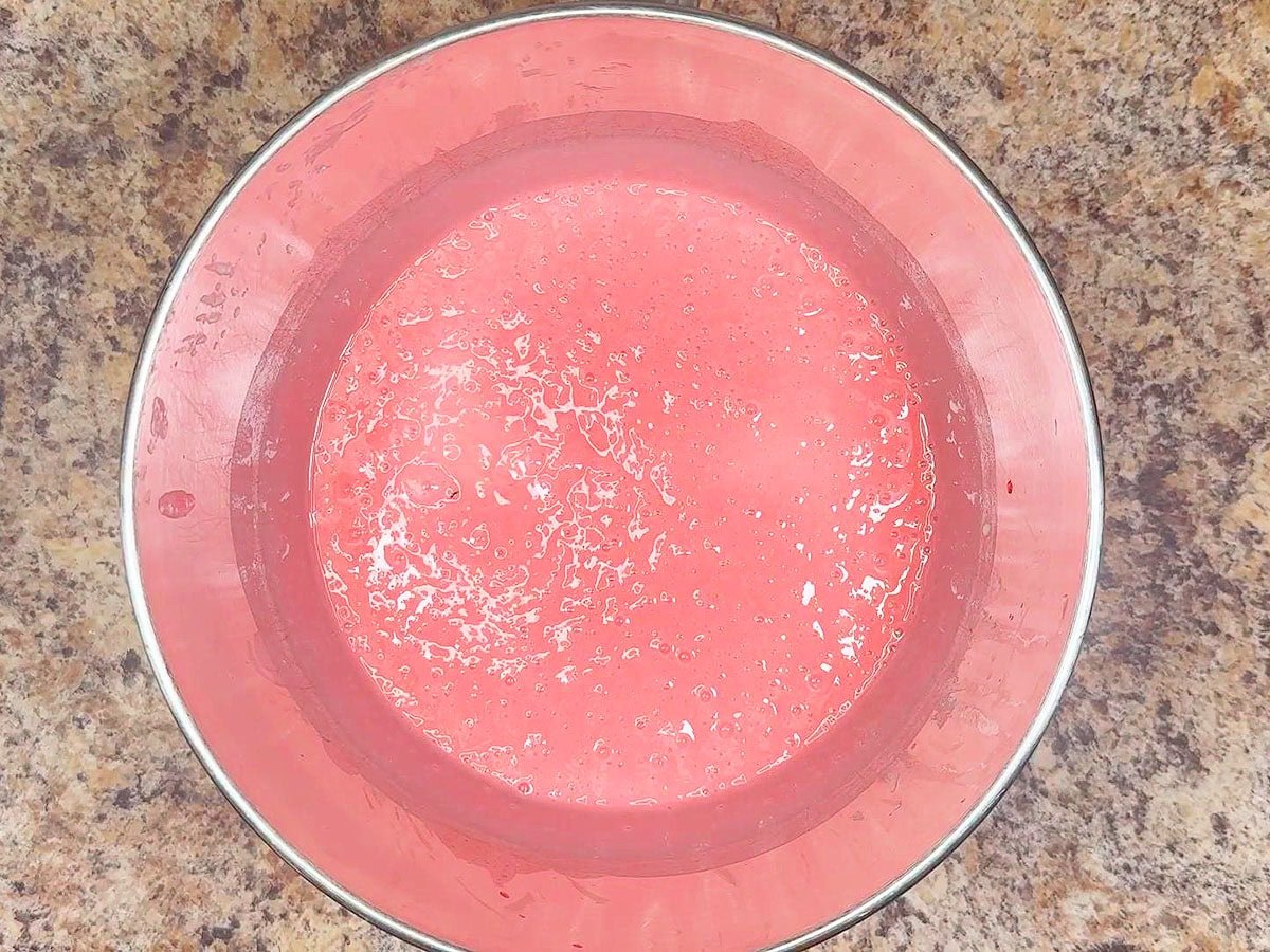 Cake batter after the strawberry gelatin has been added to the batter.