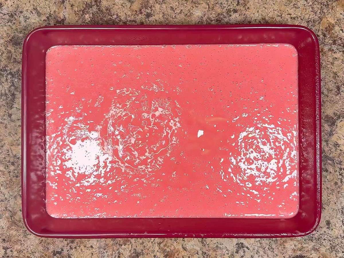 Unbaked cake batter in a 9 x 13 x 2-inch cake pan.