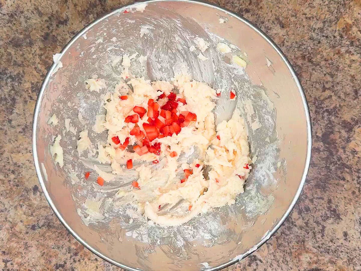 Second tablespoon of minced strawberries added to the buttercream frosting.