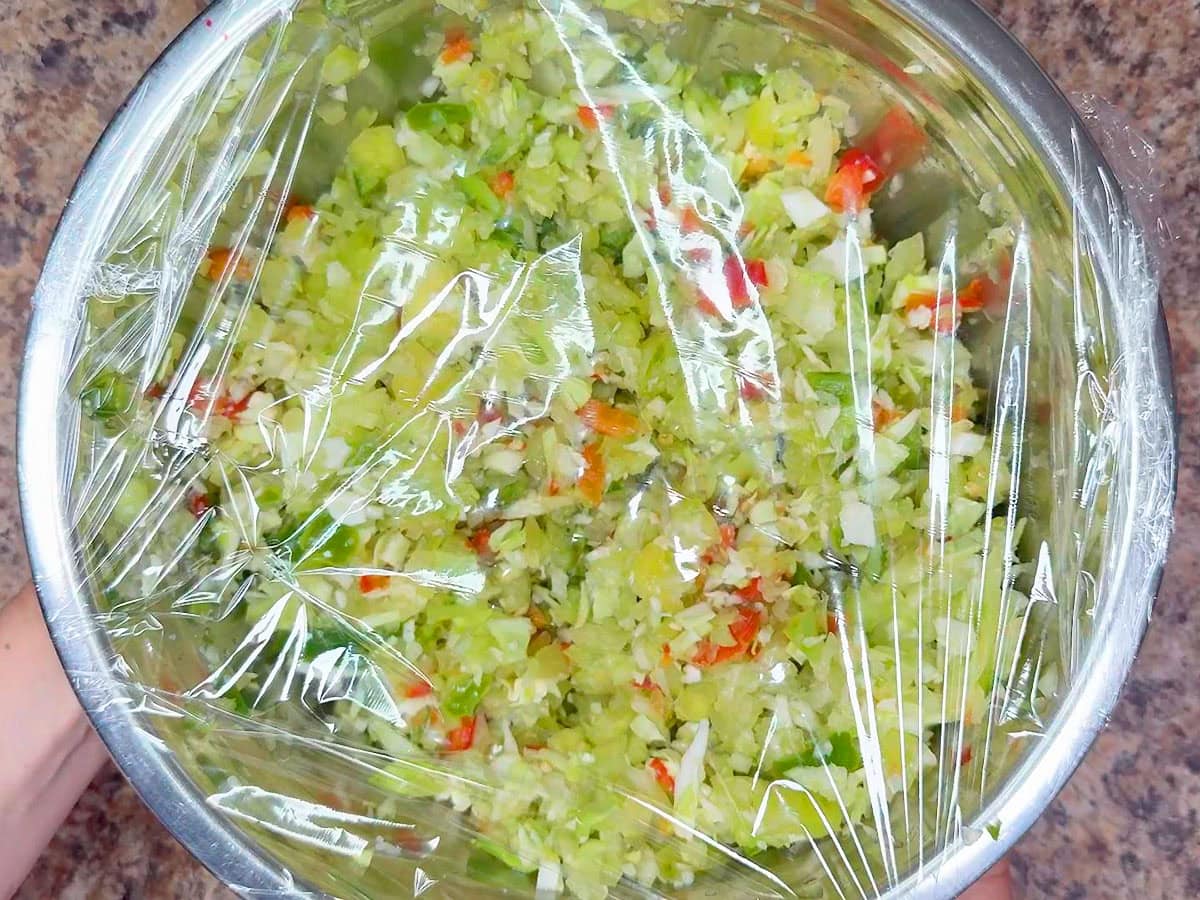 Covering the mixing bowl with the salted chopped vegetables to refrigerate overnight.