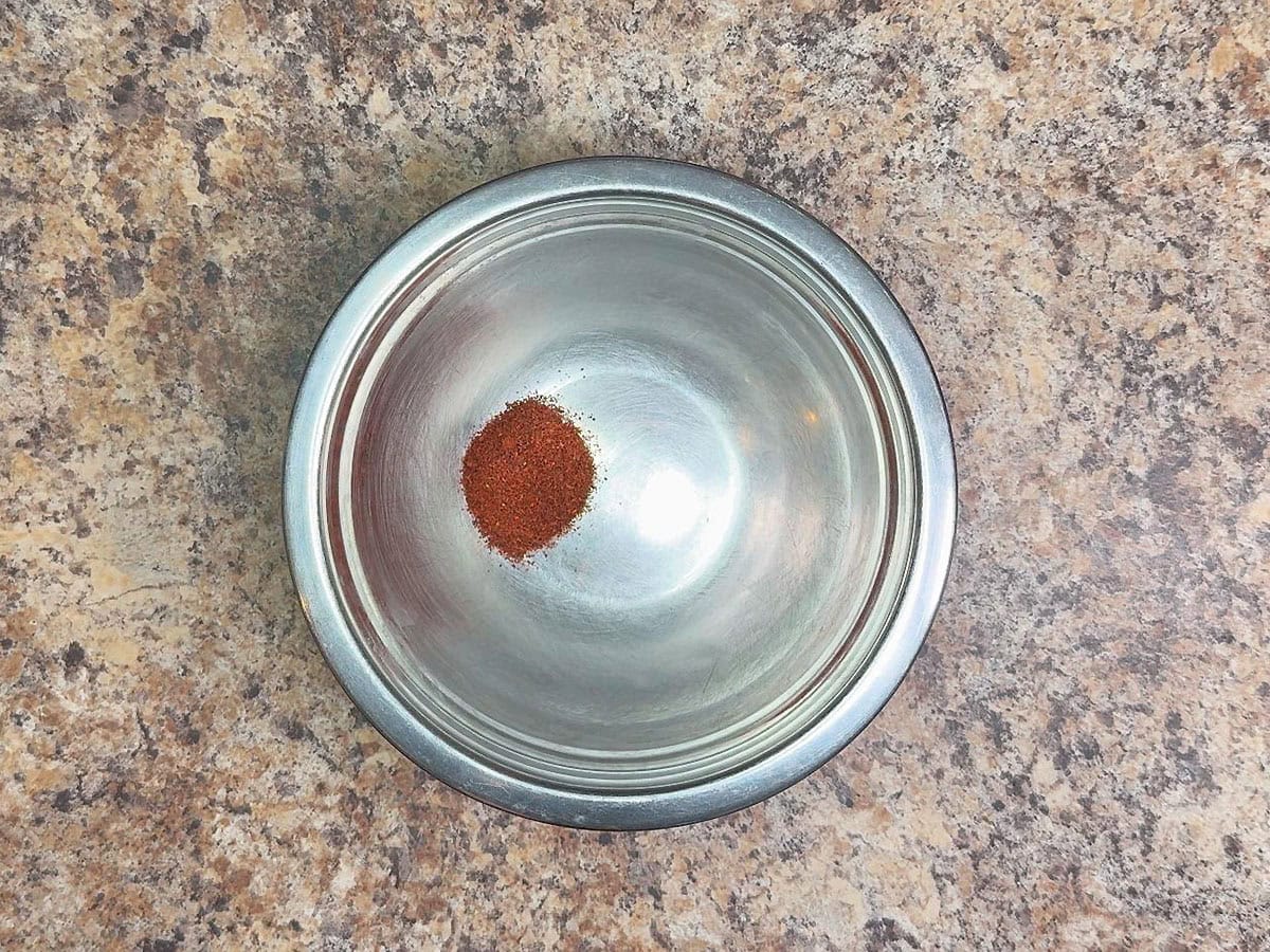 Chili powder in a small mixing bowl.