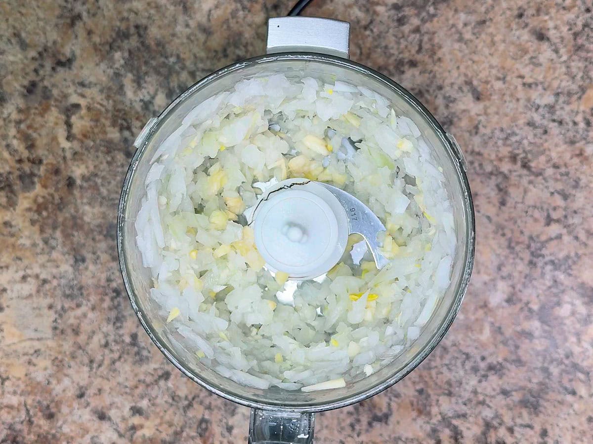 Minced onion and garlic in a food processor.