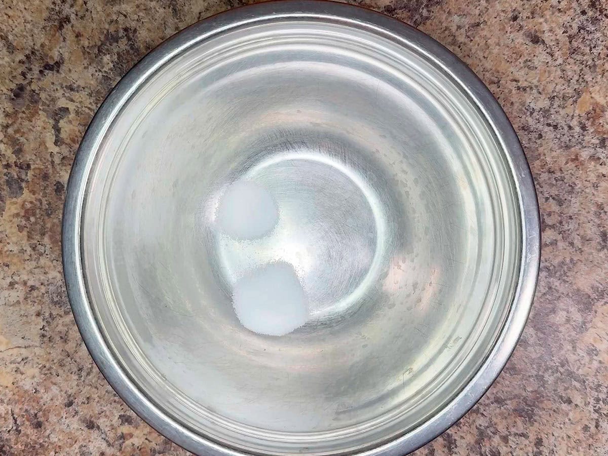 Salt and sugar in a large mixing bowl.