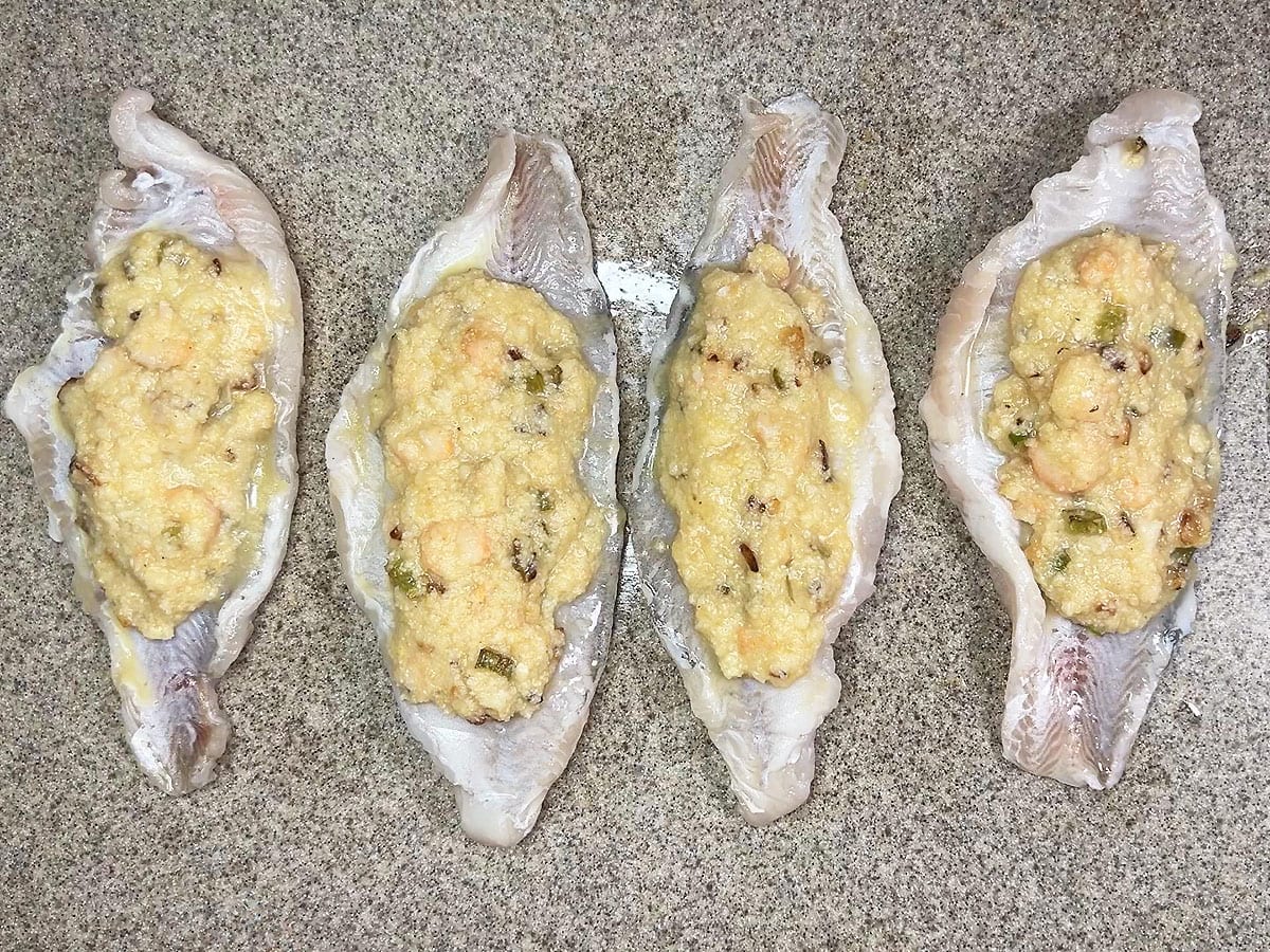 Catfish fillets with the cornbread and shrimp stuffing spooned down the middle.