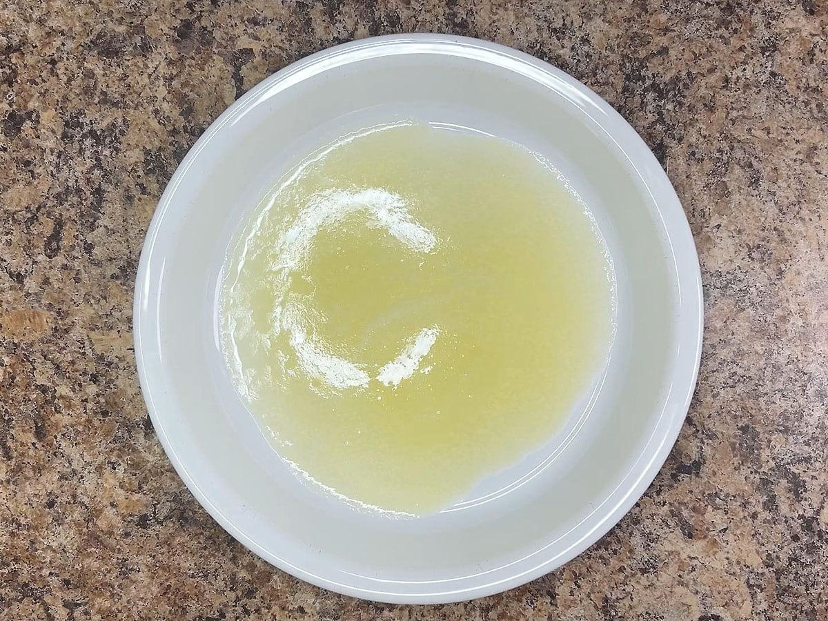 Melted butter in a shallow dish.