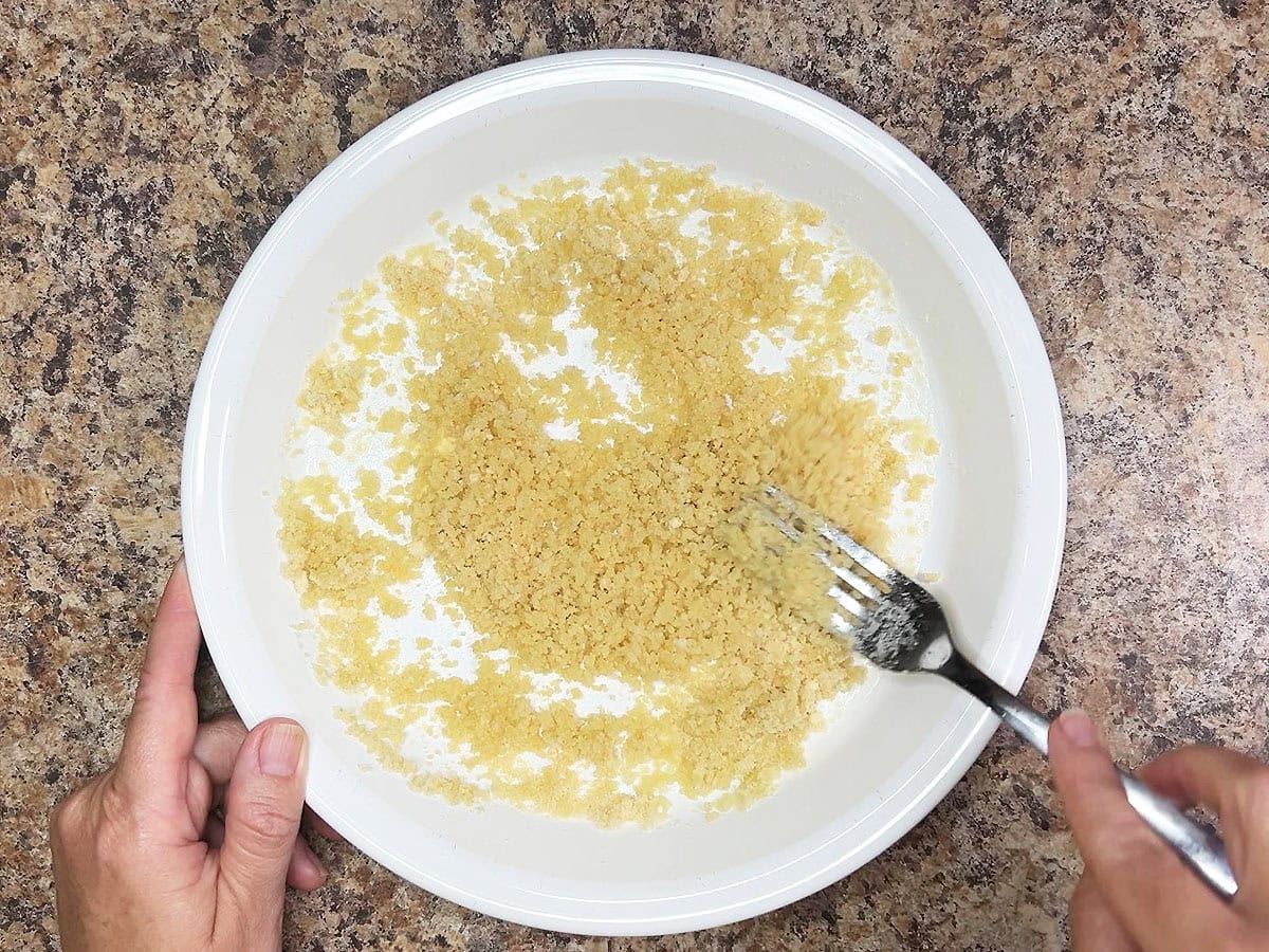 Stirring together the panko bread crumbs and Parmesan cheese.