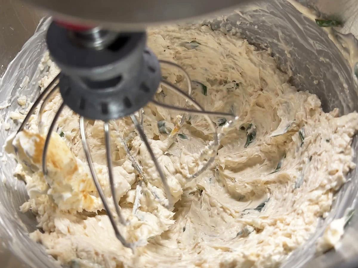 Cajun catfish dip ingredients whipped together in a mixing bowl.