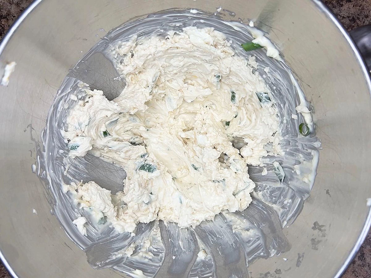 Cajun catfish dip ingredients whipped together in a mixing bowl.
