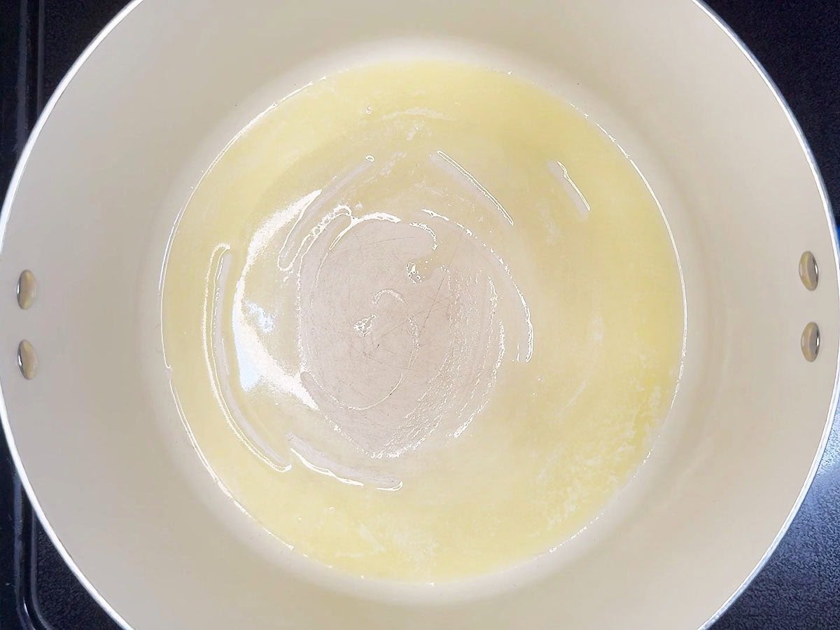 Melted butter in a large stockpot.