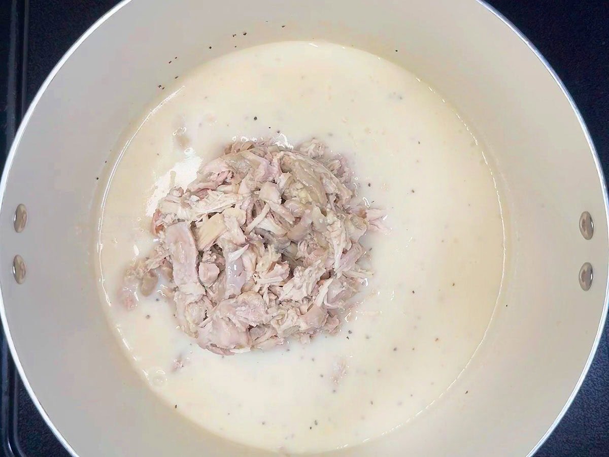 Shredded chicken added to the cream sauce.