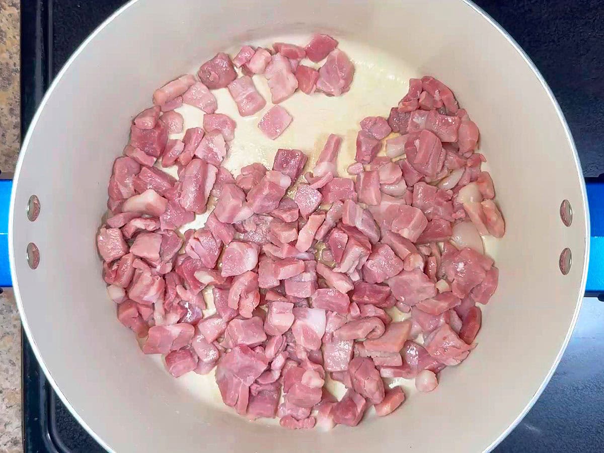 Cooked country ham in a large stockpot.