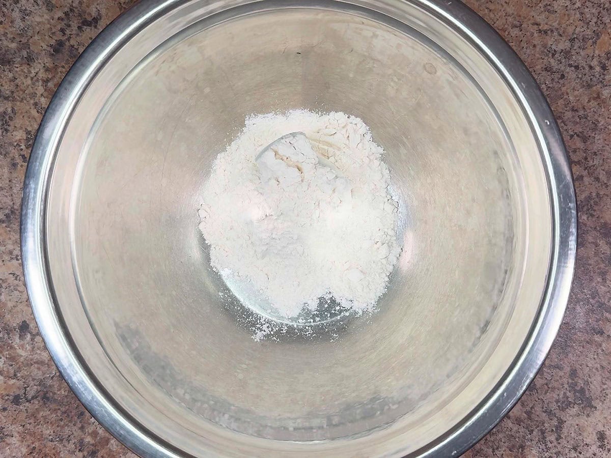 Flour in a large mixing bowl.