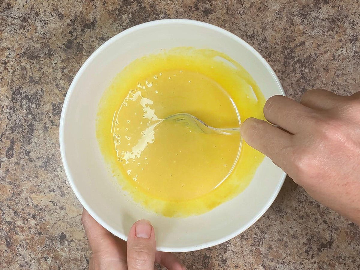 Whisking together the honey mustard sauce ingredients.