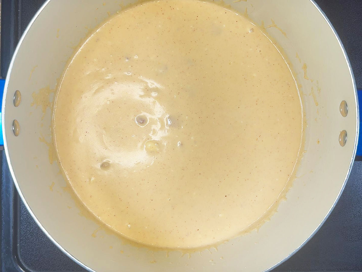 Sauce after the cream cheese, cheddar cheese, and garlic have been added.