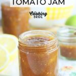 Jars of green tomato jam surrounded by sliced lemons and whole green tomatoes.