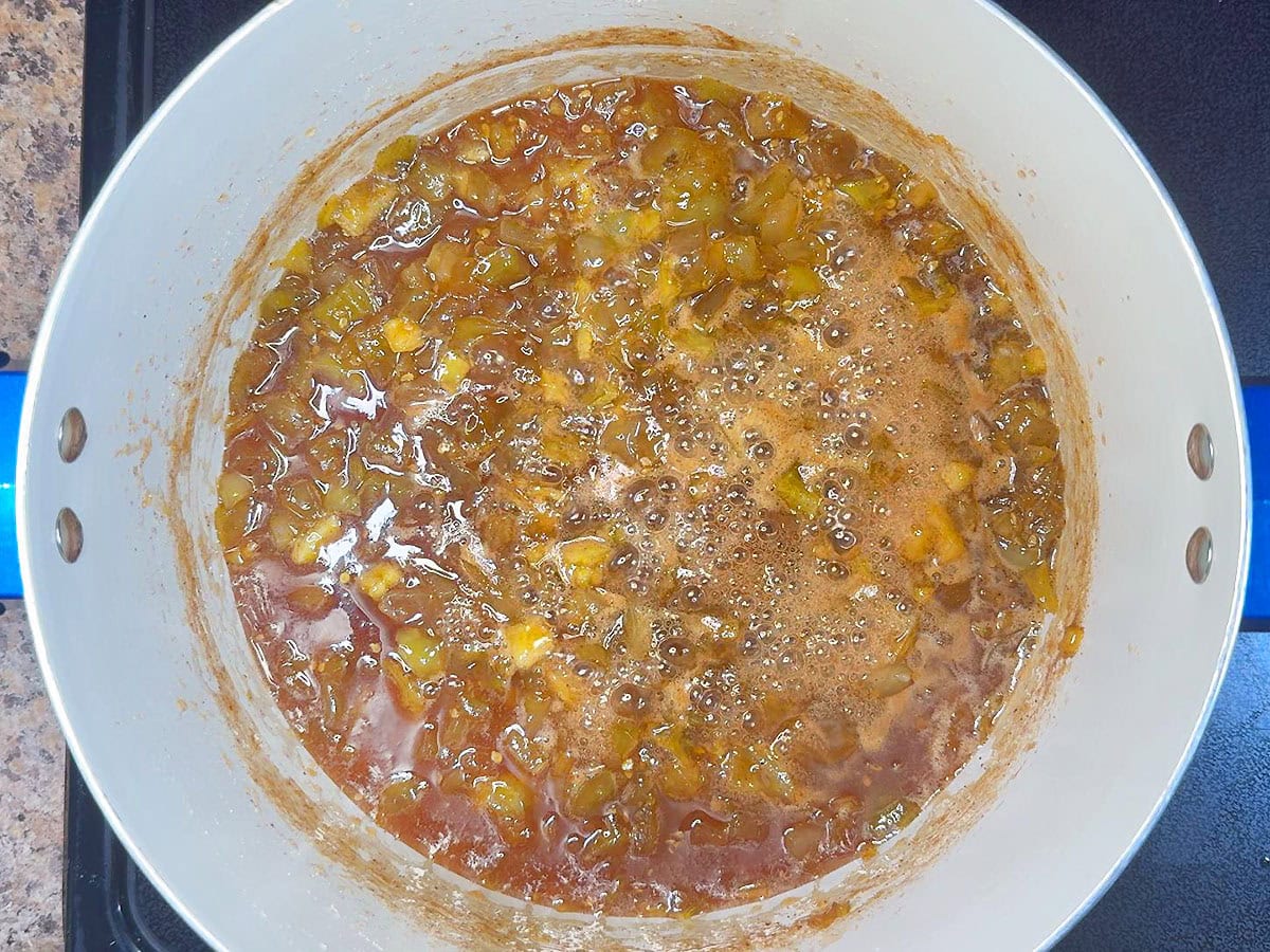 Green tomato jam after it has simmered and the tomatoes have broken down.