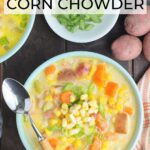 Two bowls of potato corn chowder with dishes of green onions, corn and cheese to the side.