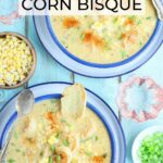 Two bowls of shrimp and corn bisque garnished with corn kernels and toasted bread.