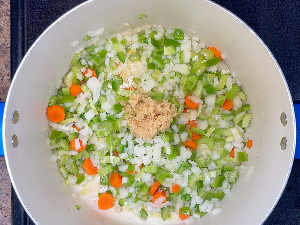 Celery, carrots, onion, and minced garlic in a stock pot with butter and olive oil.