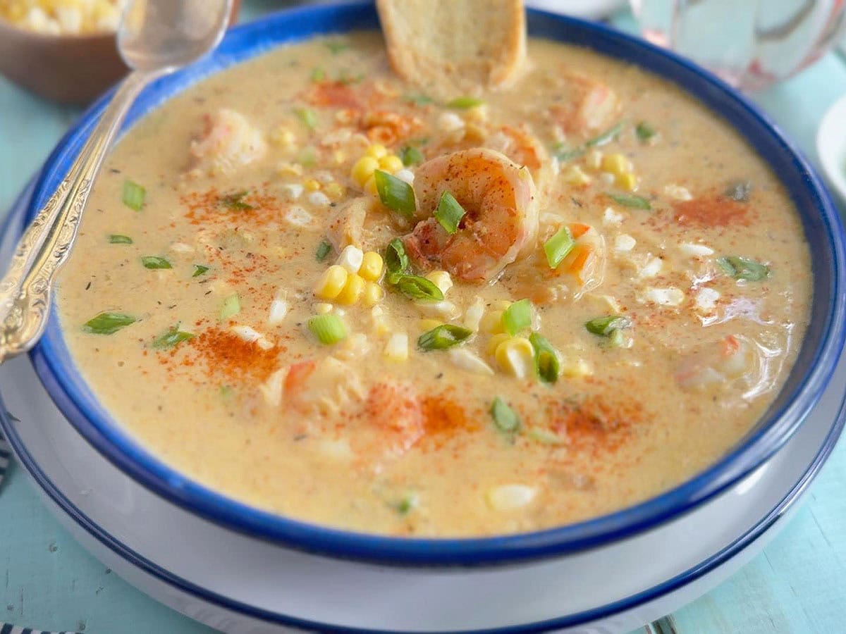 Shrimp and corn bisque garnished with green onions.