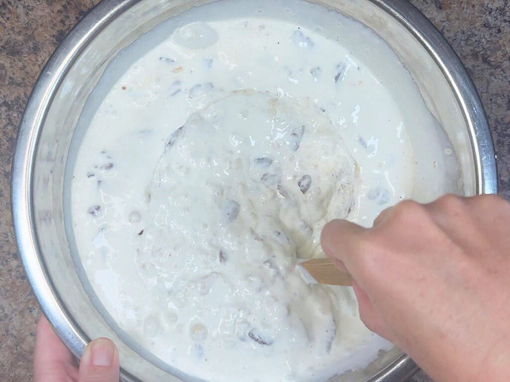 Stirring together the ingredients for the bread pudding custard base.