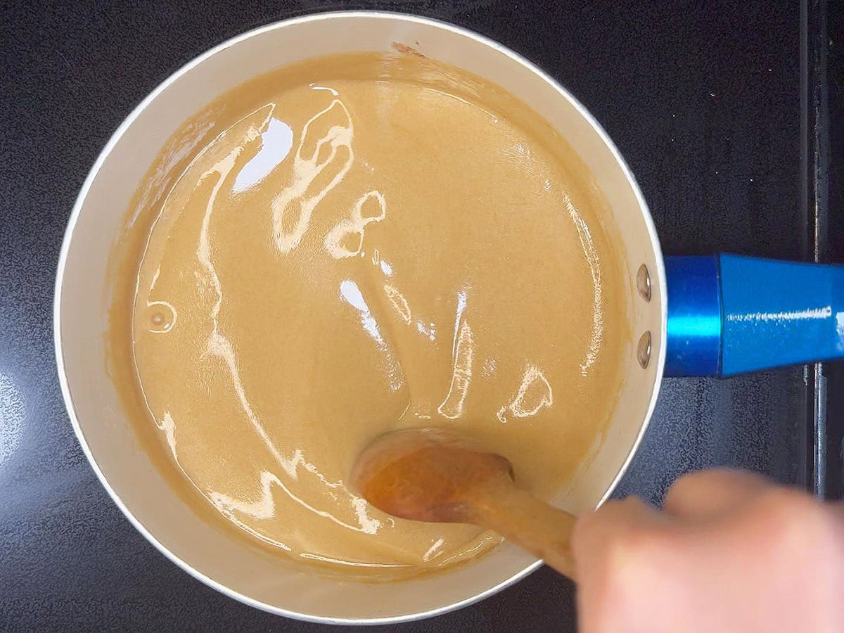 Bringing the rum sauce to a gentle simmer for 5–7 minutes.