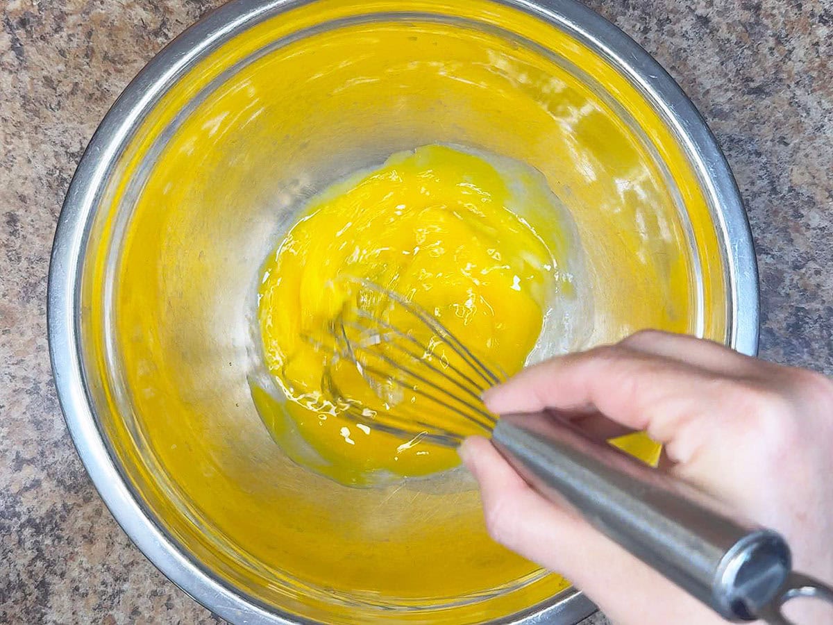 Whisking egg yolks for the creme anglaise.