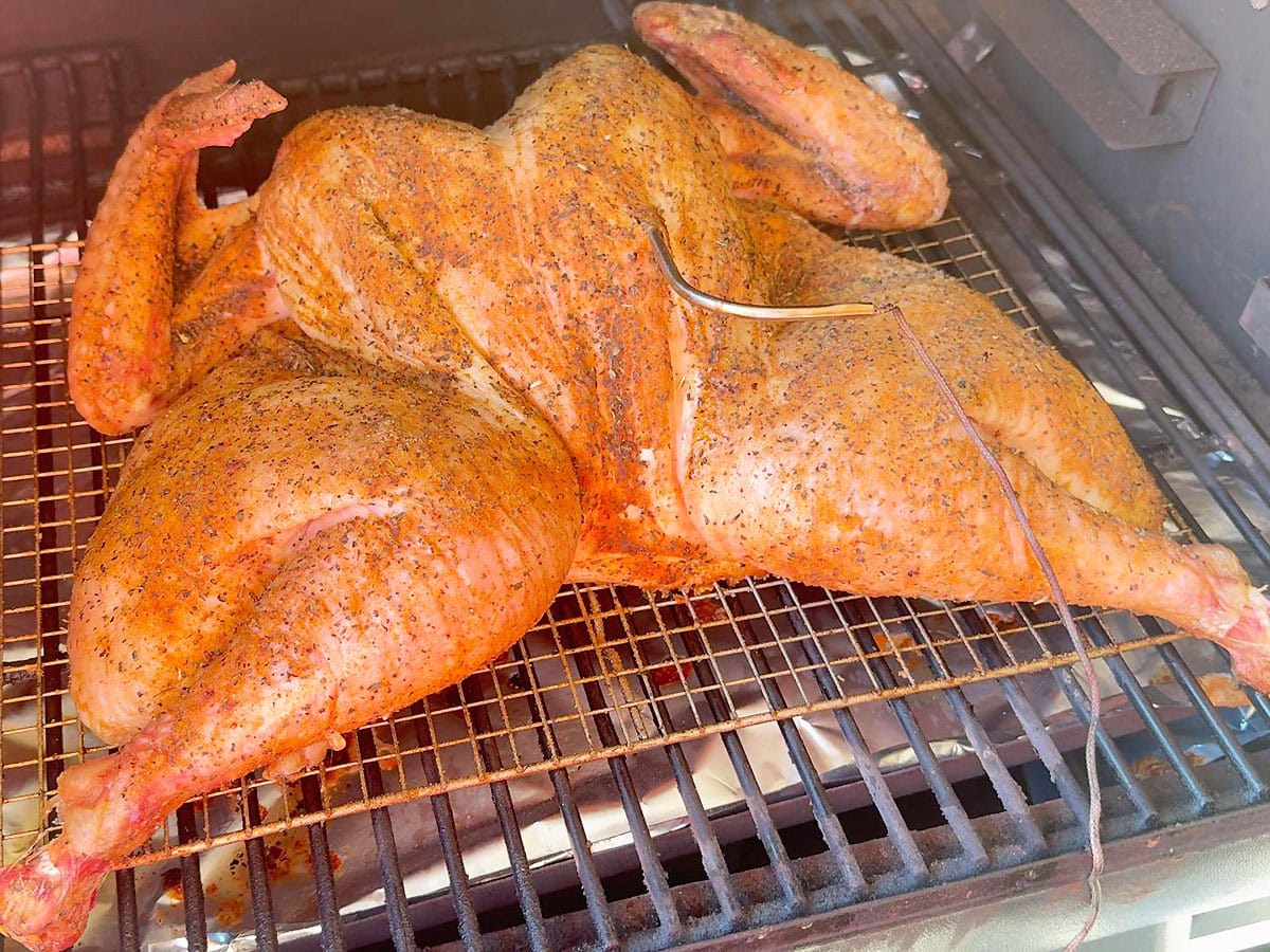 Spatchcocked turkey after it has smoked for three hours.