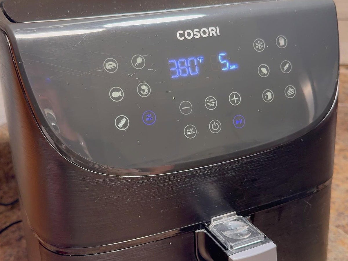 Preheating the air fryer to 380 degrees for five minutes.
