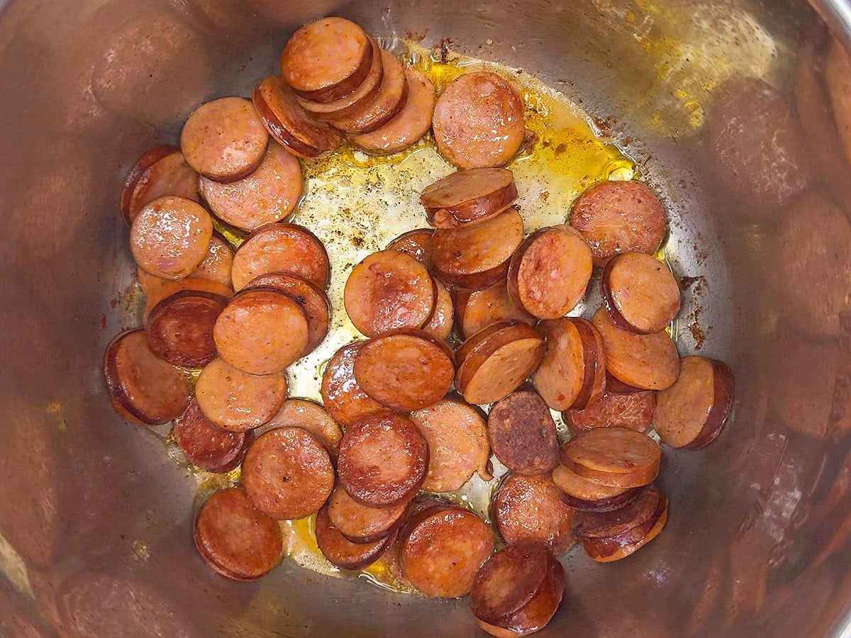 Browning the sausage in oil in the bottom of the Instant Pot.