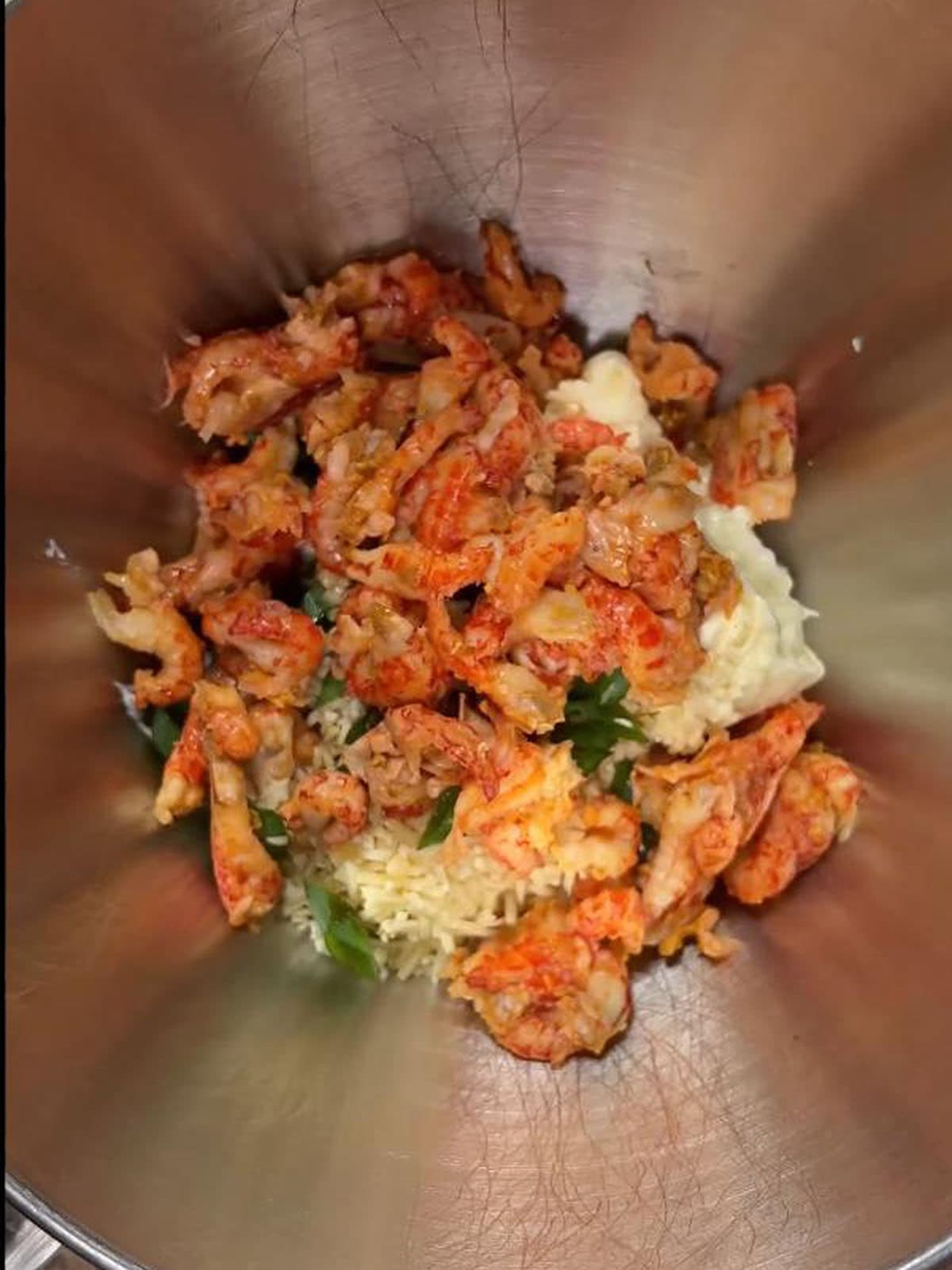 Crawfish dip ingredients measured into a large mixing bowl.