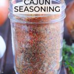 Homemade Cajun seasoning in a glass Mason jar.