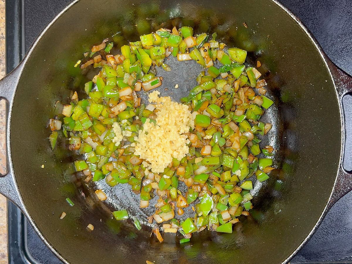 Minced garlic added to the sauteed vegetables.