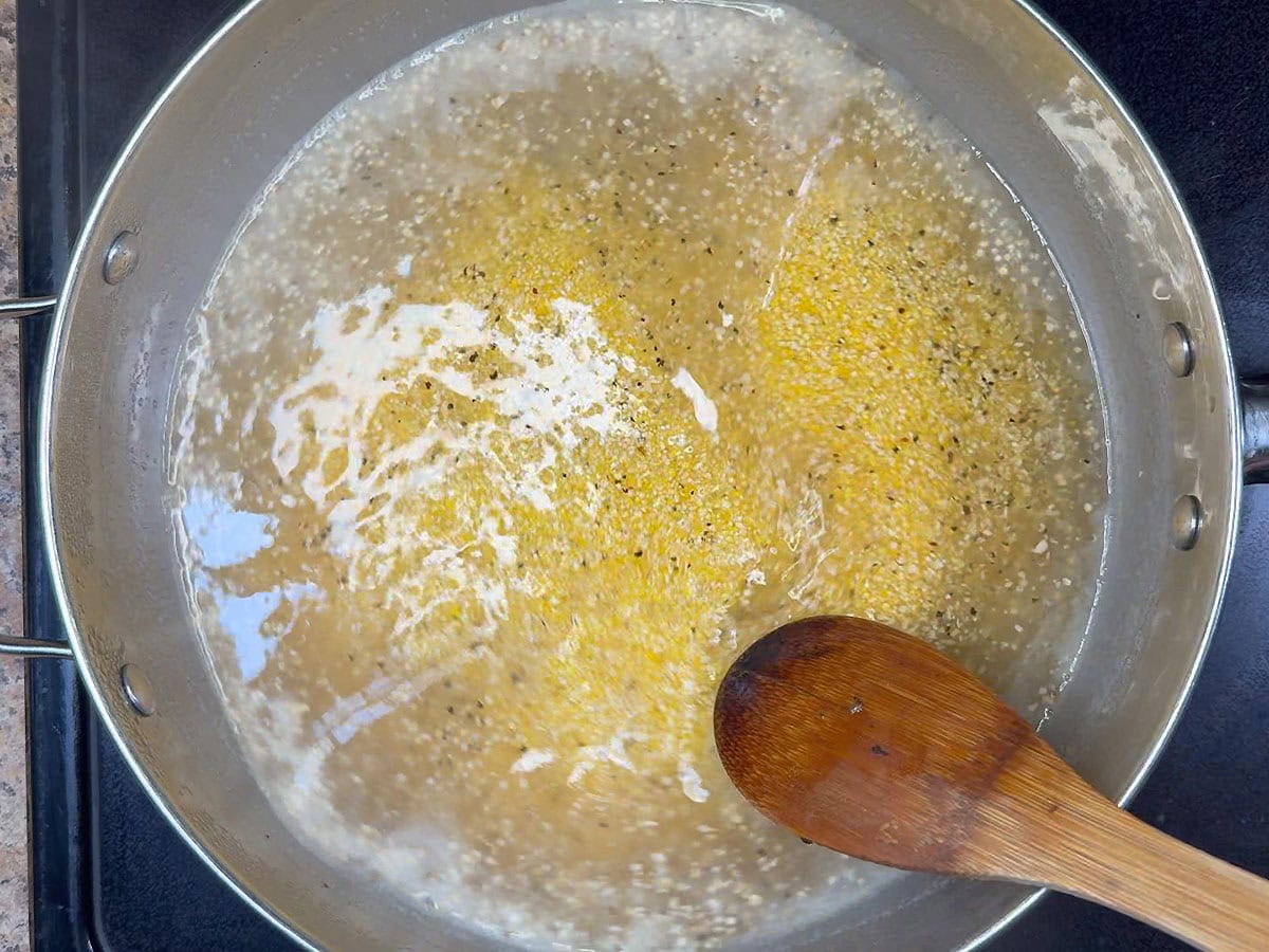 Stirring corn grits into simmering liquid