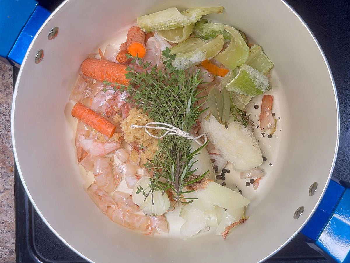 Shrimp stock ingredients in a large stock pot.