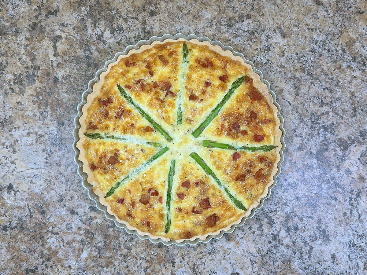 Asparagus quiche baked until golden brown.